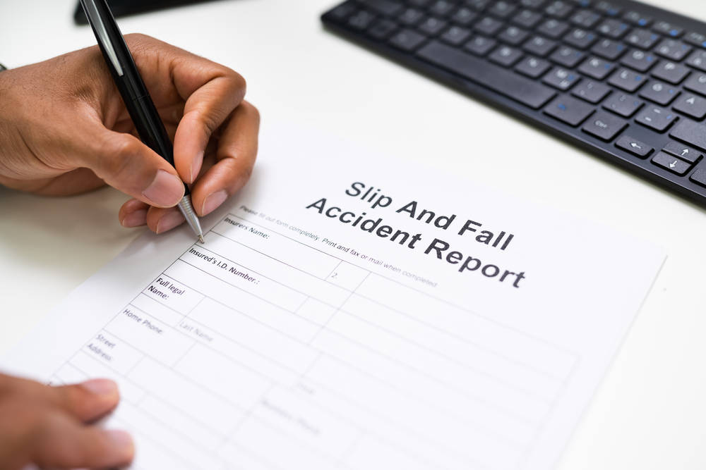 Man filling out slip and fall incident report