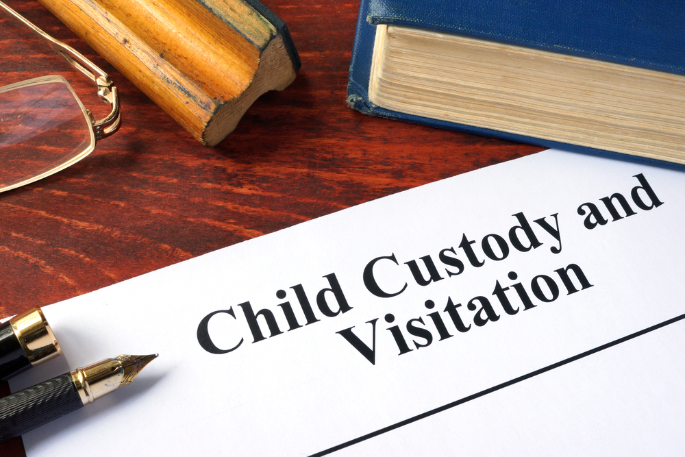 Child Custody and Visitation paperwork on desk