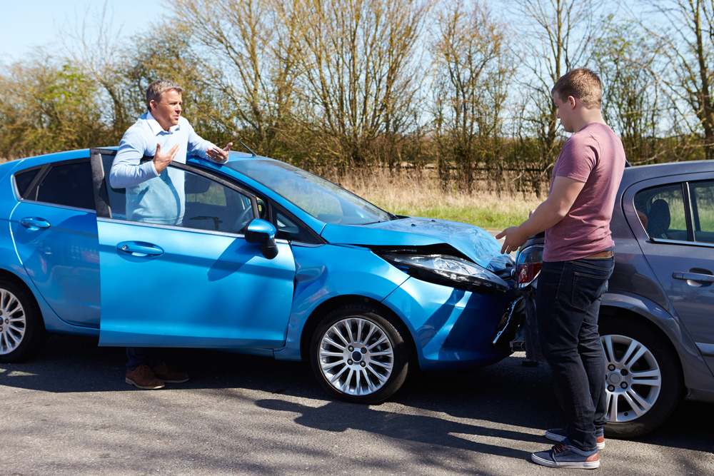 Two drivers arguing after car accident