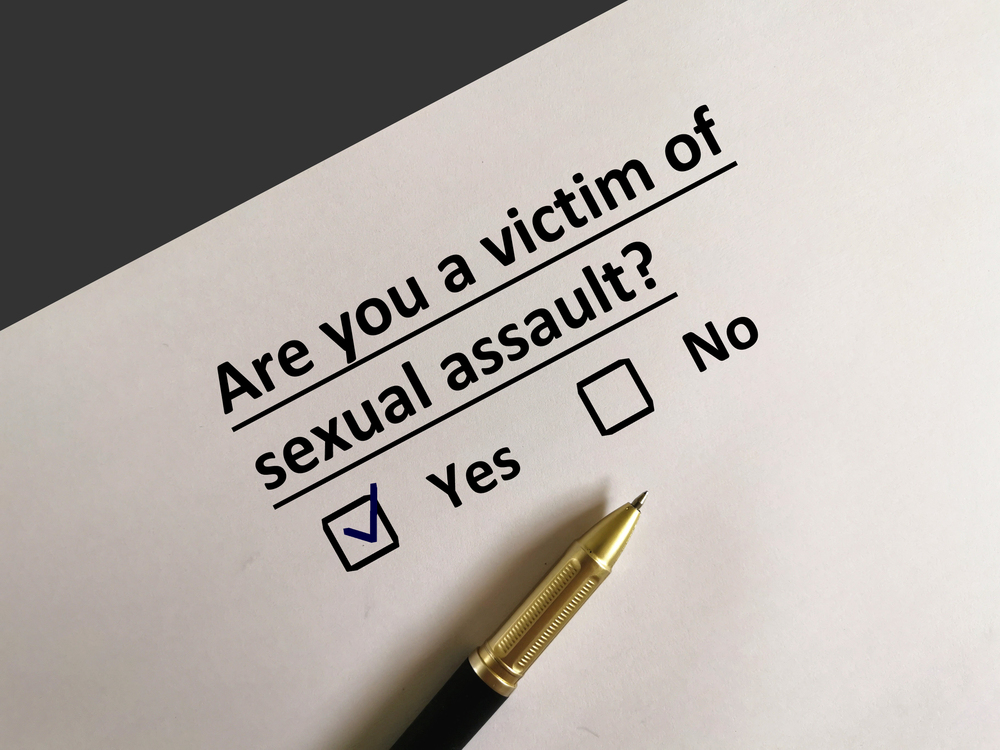 Questionnaire asking "Are you a victim of sexual assault?" and checkmark in Yes box