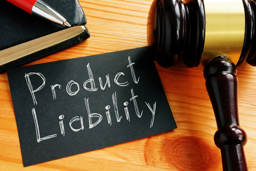 Product liability written on black paper near judge's gavel