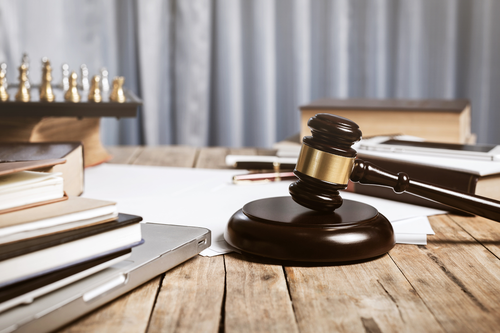 Desk with gavel, chess set, and law books