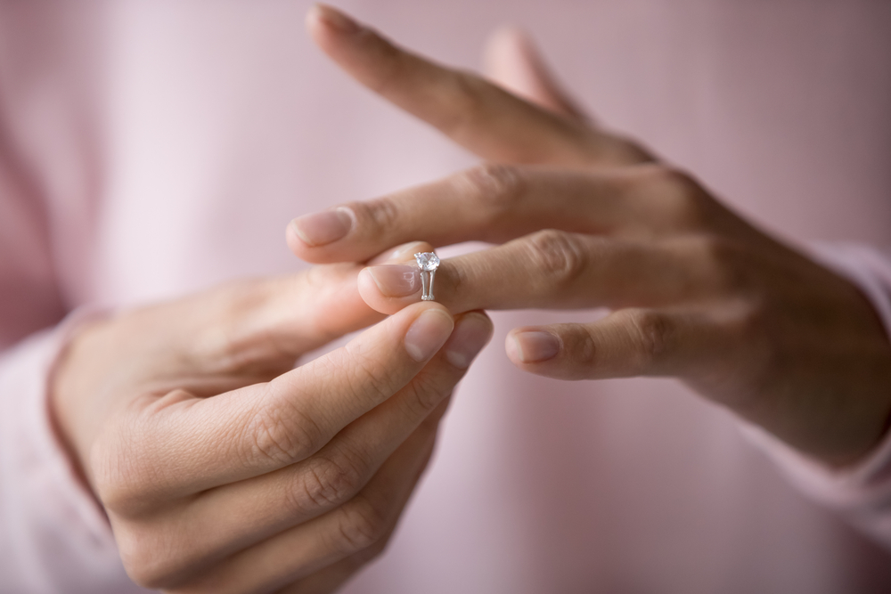 Woman removing wedding ring